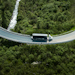 Aerial view of a truck on a winding country road