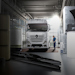 Mercedes-Benz customer solutions A white Mercedes-Benz truck parked in a mechanics workshop